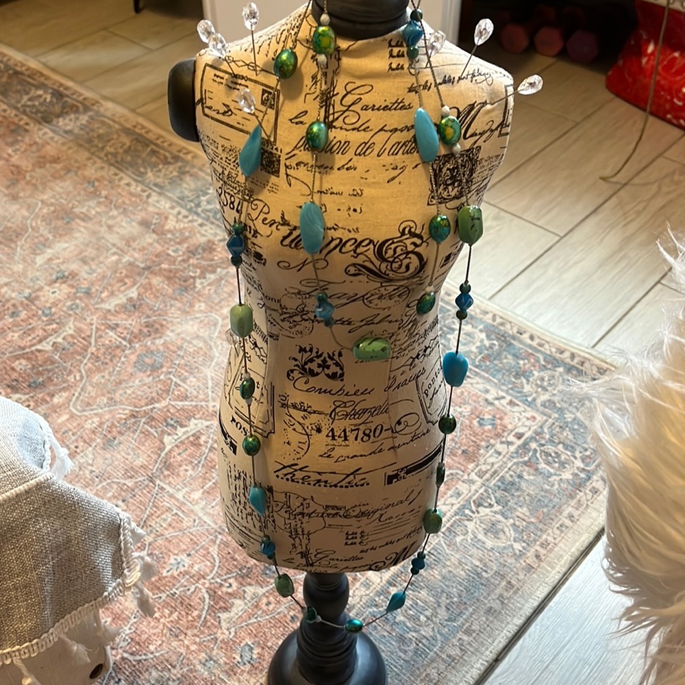 Long varying teals, aquas. Beaded with silver.
